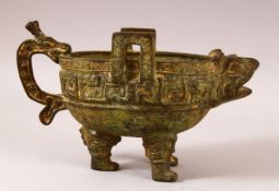A CHINESE ARCHAIC STYLE TWIN HANDLE LIBATION / POURING VESSEL - with archaic style decoration in the