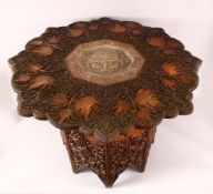 A FINE 19TH CENTURY INDIAN KASHMIRI CARVED WOODEN TABLE - the top carved in relief with leaves and
