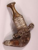 AN YEMEN WHITE METAL & RHINO HORN HANDLE JAMBIYA DAGGER - With moulded white metal mounts, with a