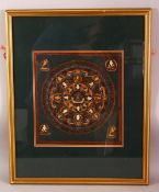 A SMALL FRAMED HAND PAINTED TIBETAN THANGKA, the central circular panel depicting various deities/