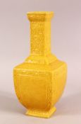 A SMALL CHINESE YELLOW GROUND SQUARE FORM VASE, with relief decoration of bats and stylised flora,
