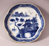 AN 18TH CENTURY CHINESE BLUE & WHITE PORCELAIN LANDSCAPE DISH - With molded rims and a landscape