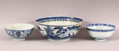 THREE CHINESE BLUE AND WHITE BOWLS, comprising two rice bowls and one large bowl (AF), largest