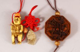A CARVED IVORY OR BONE NETSUKE together with another carved wood amulet, netsuke 5cm.