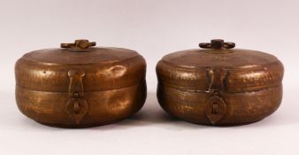 A PAIR OF INDIAN SPICE BOXES, both with hinged lid and handle to top, both approx. 21cm diameter.