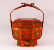 A CHINESE LACQUER LIDDED BASKET & COVER - decorated with scenes of figures amongst flora, with a