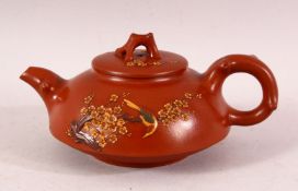 A CHINESE YIXING CLAY TEAPOT & COVER - decorated with raised birds and foliage, the base with a