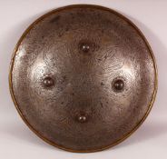 A PERSIAN QAJAR STEEL SHEILD, with etched decoration of figures and calligraphy, the face with