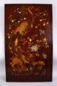 A JAPANESE MEIJI PERIOD GOLD LACQUER SHIBAYAMA PANEL, depicting a hawk upon a tree looking down at