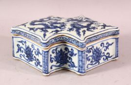 A CHINESE MING STYLE BLUE & WHITE PORCELAIN LIDDED DRAGON BOX, decorated with dragons and lotus,