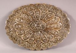 A TURKISH OTTOMAN SILVER MOUNTED MIRROR, with embossed decoration and hanging chain, 30.5cm x 22cm.