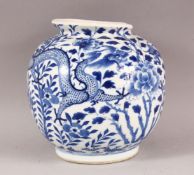 A CHINESE BLUE AND WHITE PORCELAIN VASE, painted with dragons amongst flowers, four character mark