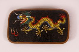 A CHINESE CLOISONNE ENAMEL DRAGON BELT BUCKLE - depicting a dragon upon black ground with flames,