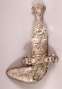 A SMALL ISLAMIC DAGGER, possibly low grade silver, and sheath, 20cm long.