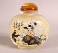 A CHINESE REVERSE PAINTED SNUFF BOTTLE - decorated with figures and moneys in landscapes - with