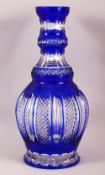 A LARGE ISLAMIC BLUE BOHEMIAN CUT GLASS HUQQA BASE, 34cm high.