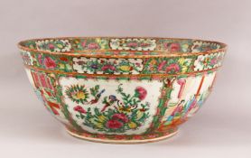 A LARGE 19TH CENTURY CHINESE CANTON FAMILLE ROSE PORCELAIN BOWL - with panel decoration of