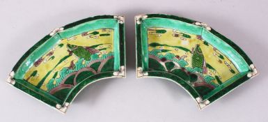 A PAIR OF CHINESE FAMILLE VERTE PORCELAIN FISH DISHES, depicting fish jumping through waves, 20cm