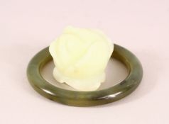 A CHINESE JADE CARVING AND JADE BANGLE, the bangle 8cm diameter.