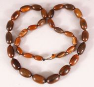 A SET OF 19TH CENTURY CHINESE QING CARVED RHINO BEAD NECKLACE - the 33 beads of graduating form ,