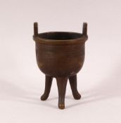 A SMALL 19TH CENTURY CHINESE TWIN HANDLE TRIPOD CENSER, the body with greek key decoration, 9.5cm