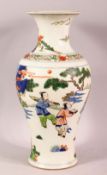 A CHINESE FAMILLE VERTE PORCELAIN VASE, decorated with scenes of immortal figures, the base with a