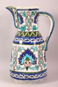 A GOOD IZNIK STYLE POTTERY EWER - finely decorated with colourful floral motifs, Poss 19thc, 27cm