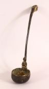 AN ARCHAIC STYLE BRONZE LADLE, the handle with dragon-like head, the foot of the handle with praying