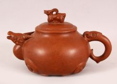 A CHINESE YIXING CLAY RAMS HEAD TEAPOT, in the form of a rams head and finail of a ram, the