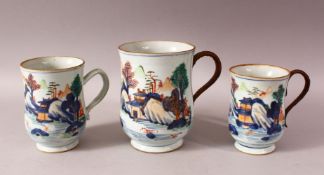 THREE 18TH CENTURY CHINESE IMARI PORCELAIN TANKARDS - each decorated in a similar style depicting
