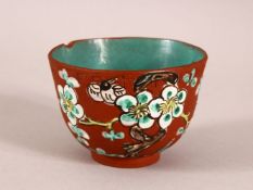 A CHINESE YIXING CLAY TEA BOWL - the exterior enameled with birds and flora - the interior with a