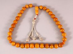 A FINE SET OF CHINESE OR ISLAMIC AMBER PRAYER BEADS, the string comprising of 35 beads and toggle