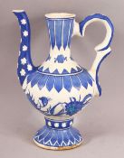 A TURKISH IZNIK POTTERY WATER SURAHI CARAFE - with flowing floral decorations, 20cm