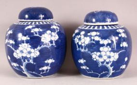 TWO 19TH / 20TH CENTURY CHINESE BLUE & WHITE PORCELAIN PRUNUS JARS & COVERS - each with prunus