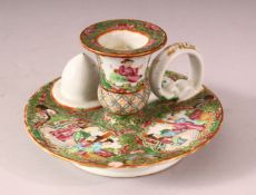 A 19TH CENTURY CHINESE CANTON FAMILLE ROSE PORCELAIN CHAMBER STICK - decorated with panels of