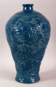 A CHINESE BLUE GROUND POTTERY DRAGON VASE, with dragons either side of the pearl of wisdom against