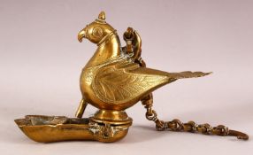 AN INDIAN BRASS HANGING LAMP in the form of a parrot, the hinged well in the form of the feet.