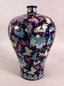 AN UNUSUAL CHINESE BLUE GROUND PORCELAIN BUTTERFLY VASE, the body profusely decorated with