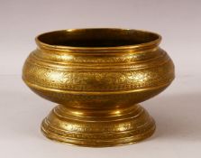 A GOOD ISLAMIC ENGRAVED AND CHASED PEDESTAL BRASS BOWL, profusely decorated with bands of foliate