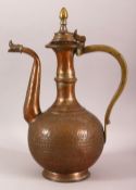 AN ISLAMIC BRONZE EWER, with hinged lid and engraved decoration, 36cm high.