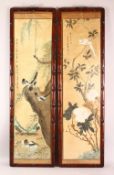 A LARGE PAIR OF HARDWOOD FRAMED CHINESE SCROLL PAINTINGS, each depicting scenes of birds amongst