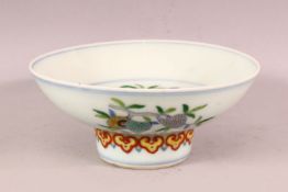 A CHINESE DOUCAI DECORATED PORCELAIN STEM DISH, - decorated with fruits and peach, the base with a