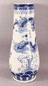 A LARGE CHINESE BLUE AND WHITE TAPERING VASE / STICK STAND, the body painted with dragons around the