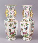 A PAIR OF 19TH CENTURY CHINESE CANTON FAMILLE ROSE PORCELAIN VASES, with a white ground decorated