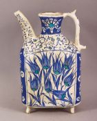 A TURKISH IZNIK POTTERY WATER VESSEL - decorated in blue & white depicting flora, 20cm
