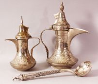TWO INDIAN DALLAH WHITE METAL COFFEE POTS & LADLE - The ladle possibly with a silver handle,