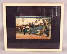 A JAPANESE FRAMED WOOD BLOCK PRINT - depicting figures in village life, 58cm x 48cm