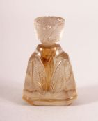 A VERY SMALL INDIAN CARVED ROCK CRYSTAL PERFUME BOTTLE AND STOPPER, 4cm high.