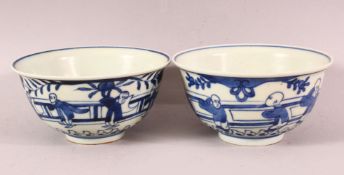 A PAIR OF CHINESE BLUE & WHITE PORCELAIN BOWLS - each decorated in similar style depicting figures
