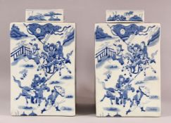 A LARGE PAIR OF CHINESE BLUE & WHITE SQUARE FORMED CADDY & COVERS, each decorated with scenes off